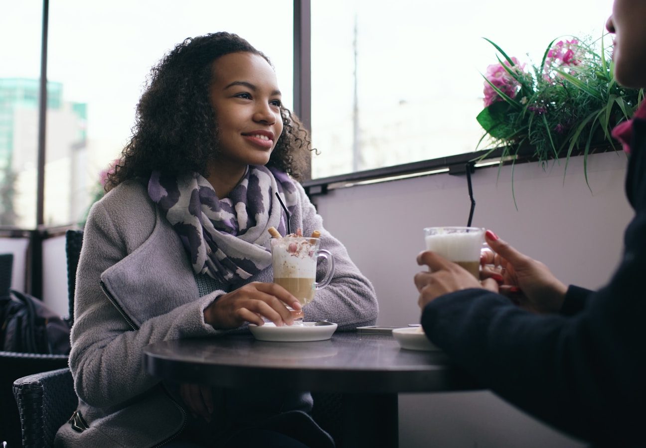 Two people enjoying coffee at a cafe