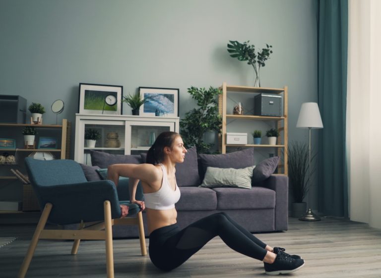 a woman sitting on the floor in a living room